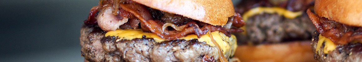 Eating Burger Greek Sandwich at Showmars University restaurant in Charlotte, NC.